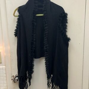 Saachi sweater Vest With Fur lining around Edges Ans Down The Sides .